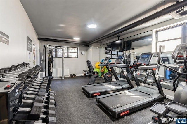 workout area featuring baseboards