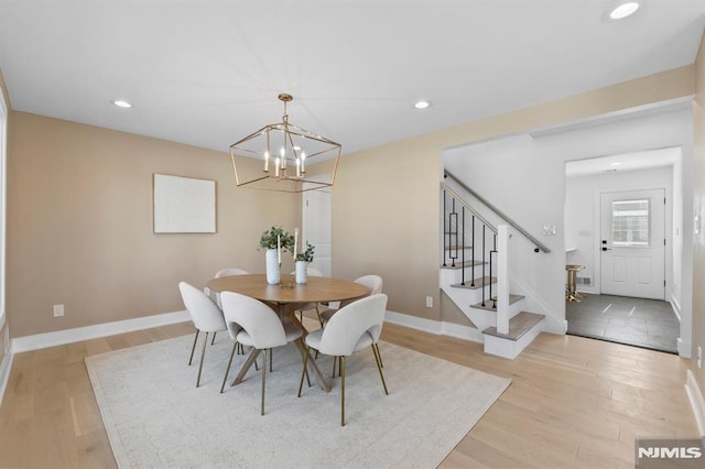 dining room featuring recessed lighting, a chandelier, stairs, and light wood finished floors