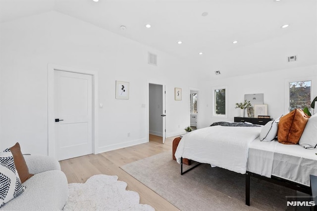 bedroom featuring light wood-type flooring, visible vents, baseboards, and recessed lighting