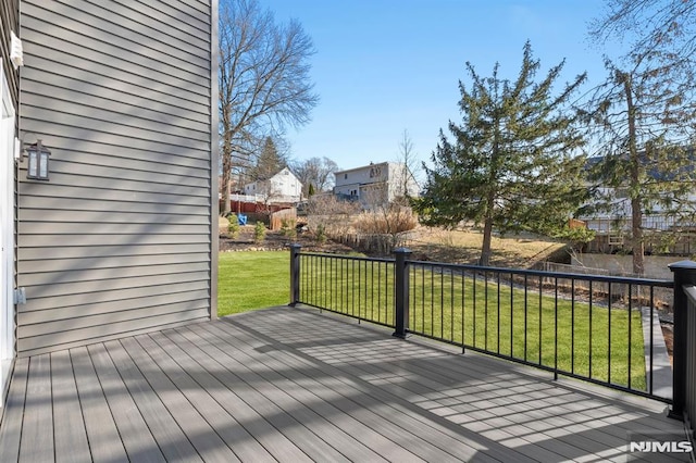 wooden deck with a yard