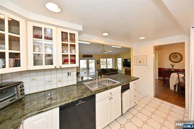 kitchen with a sink, white cabinetry, recessed lighting, glass insert cabinets, and dishwasher