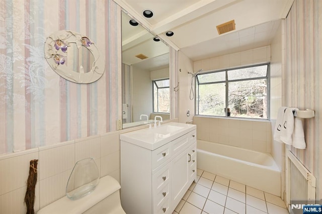 full bath with vanity, visible vents, wallpapered walls, tile patterned floors, and toilet