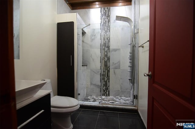 75 Liberty Ave Unit B23, Jersey City, NJ 07306 - bathroom with toilet, a stall shower, vanity, and tile patterned flooring