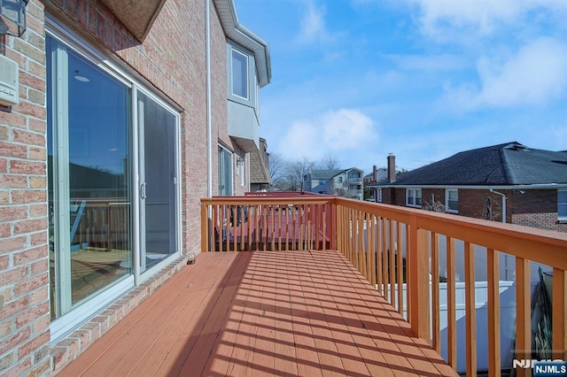 wooden deck featuring a residential view