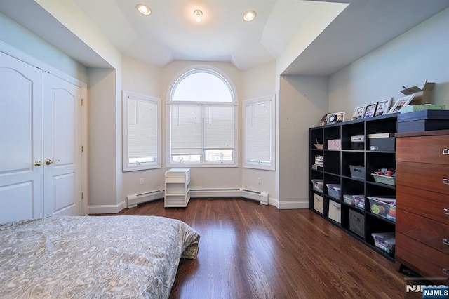 bedroom featuring recessed lighting, a baseboard radiator, baseboards, and dark wood-style flooring