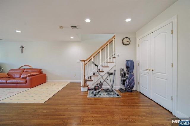 interior space with recessed lighting, visible vents, baseboards, and wood finished floors