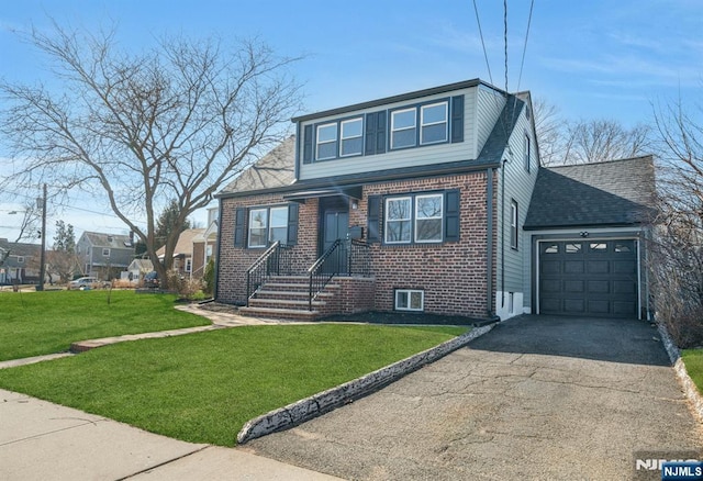 bungalow with a garage, driveway, brick siding, and a front yard