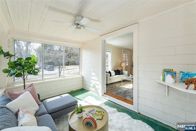 sunroom / solarium with wooden ceiling and ceiling fan