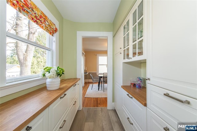 interior space with dark wood-type flooring and baseboards