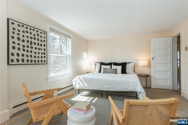 bedroom with baseboards, crown molding, carpet, and a baseboard radiator