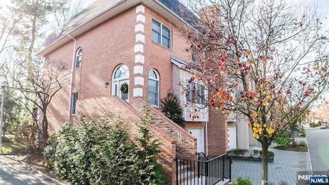 exterior space featuring brick siding