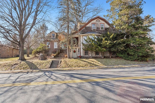 shingle-style home with stairs