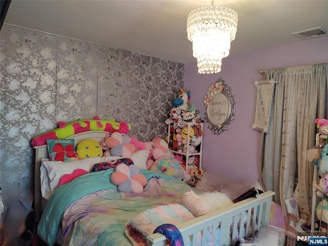 bedroom featuring a notable chandelier and visible vents