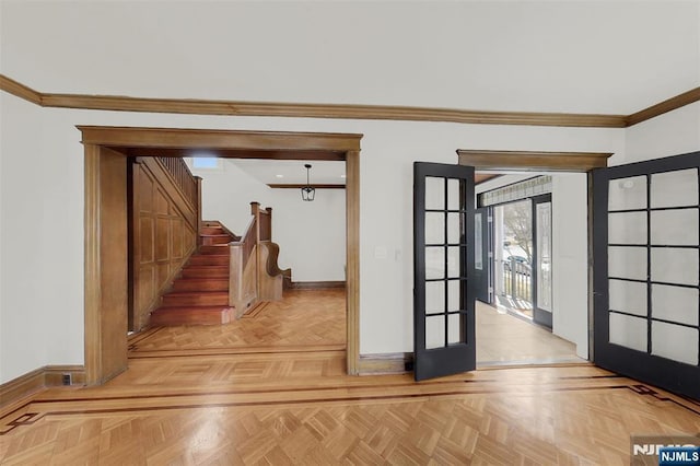 interior space featuring french doors, baseboards, and ornamental molding