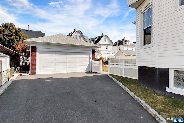 detached garage with fence