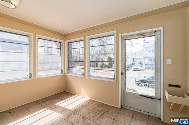 unfurnished sunroom with a wealth of natural light