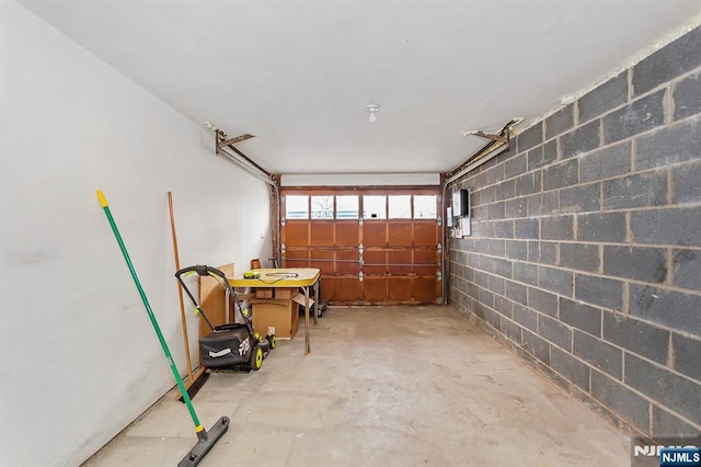 garage featuring concrete block wall