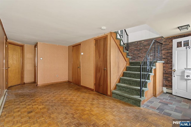 interior space featuring stairway and baseboards