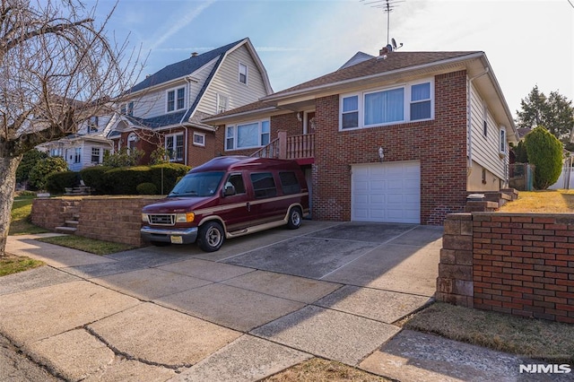 view of front of property with brick siding, an attached garage, a residential view, roof with shingles, and driveway