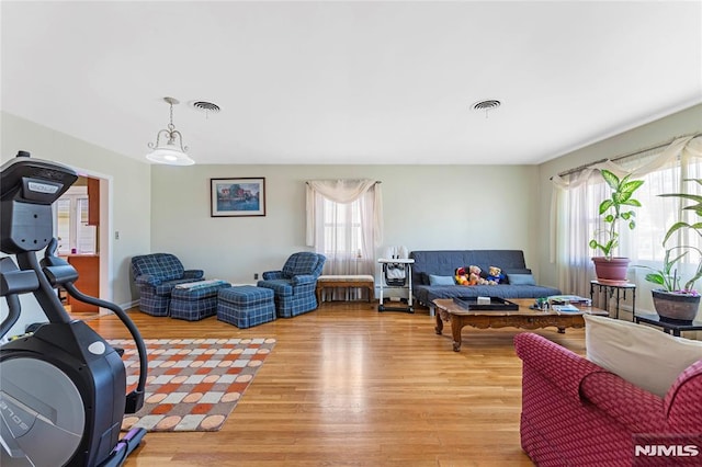 living room featuring visible vents and light wood finished floors