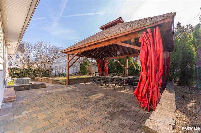 view of patio / terrace with a gazebo and outdoor dining area