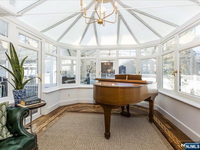 sunroom featuring lofted ceiling