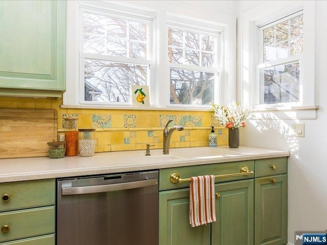 bar with a sink, backsplash, and dishwasher