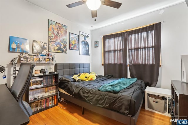 bedroom featuring wood finished floors and ceiling fan