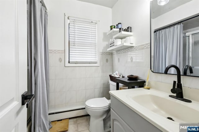 bathroom with vanity, a shower with curtain, a baseboard heating unit, tile patterned floors, and toilet