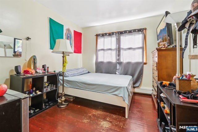 bedroom with wood finished floors