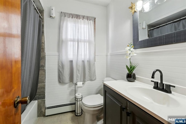 bathroom featuring vanity, toilet, baseboard heating, and wainscoting