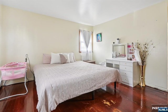 bedroom with wood finished floors