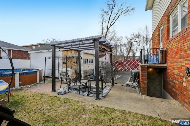 view of patio featuring a fenced in pool, fence, and a pergola