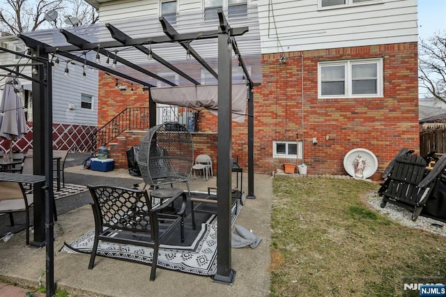 view of patio / terrace featuring a pergola and fence