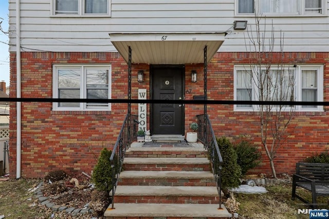 entrance to property with brick siding