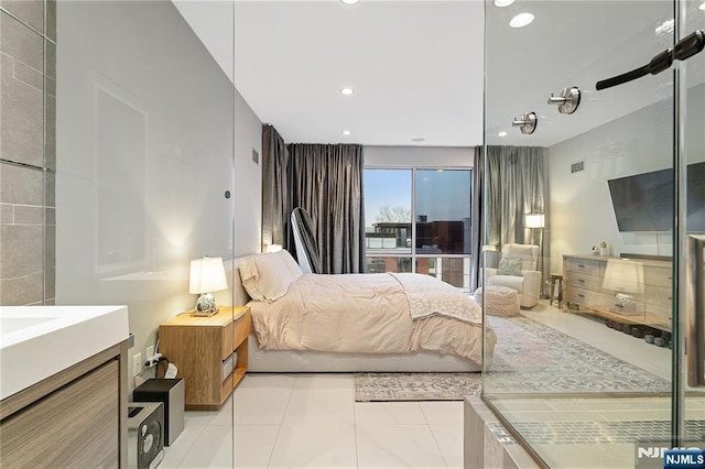 bedroom with recessed lighting and light tile patterned flooring