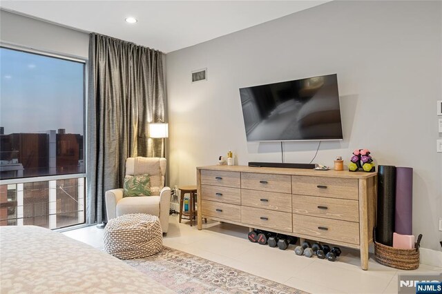 bedroom with tile patterned floors, visible vents, and recessed lighting