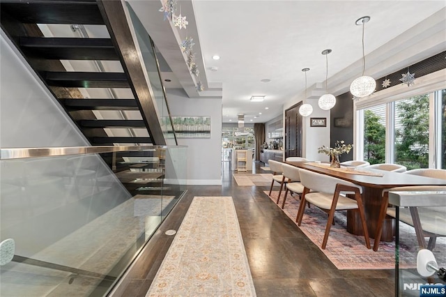 dining room with stairway, recessed lighting, baseboards, and wood finished floors