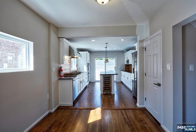 kitchen with white cabinetry, decorative backsplash, beverage cooler, and dark wood-style flooring