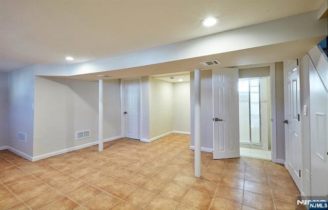 finished below grade area featuring recessed lighting, visible vents, and baseboards