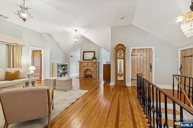 274 Ridgewood, Glen Ridge, NJ 07028 - living area featuring a chandelier, lofted ceiling, light wood finished floors, and baseboards