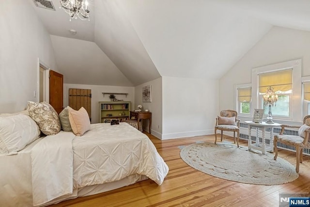 274 Ridgewood, Glen Ridge, NJ 07028 - bedroom with a chandelier, vaulted ceiling, light wood-style flooring, and baseboards