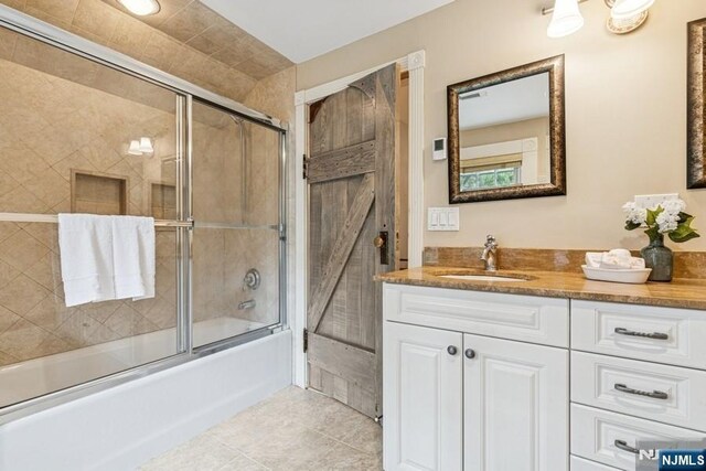 274 Ridgewood, Glen Ridge, NJ 07028 - bathroom with vanity, enclosed tub / shower combo, and tile patterned floors