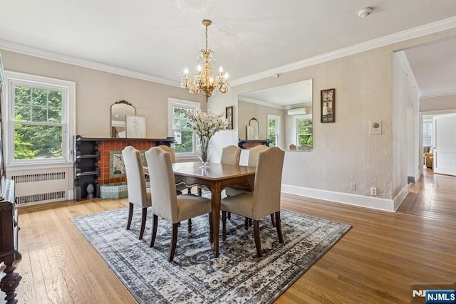 274 Ridgewood, Glen Ridge, NJ 07028 - dining space with radiator, wood finished floors, a chandelier, an AC wall unit, and ornamental molding