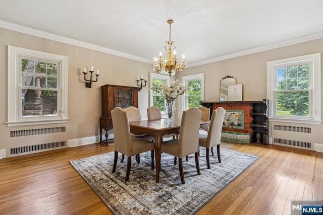 274 Ridgewood, Glen Ridge, NJ 07028 - dining space featuring radiator, a chandelier, wood-type flooring, crown molding, and baseboards