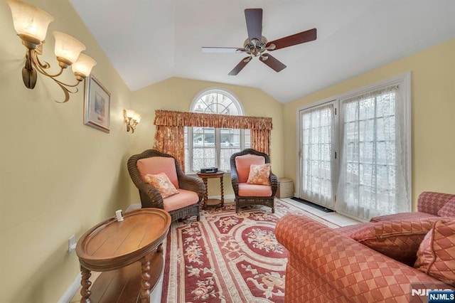 living area featuring lofted ceiling and ceiling fan