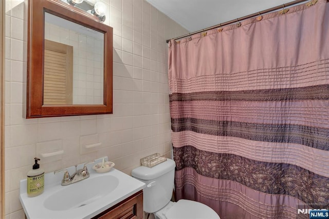 full bath with vanity, tile walls, toilet, and a shower with shower curtain