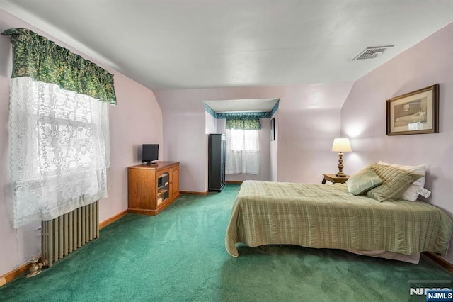 carpeted bedroom with radiator, baseboards, and visible vents