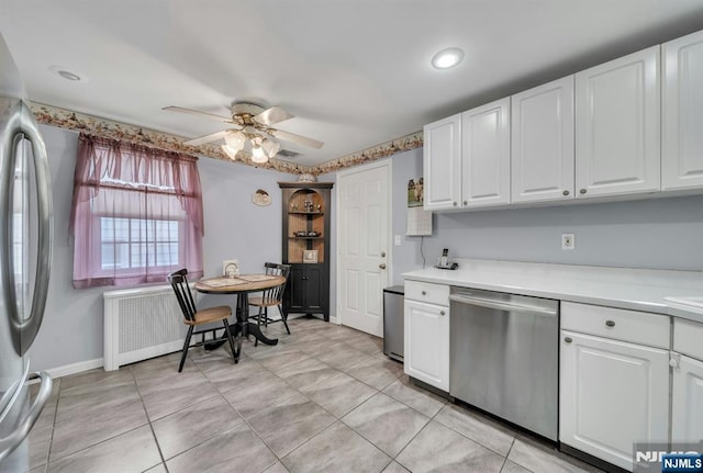 kitchen with white cabinetry, appliances with stainless steel finishes, ceiling fan, and light countertops