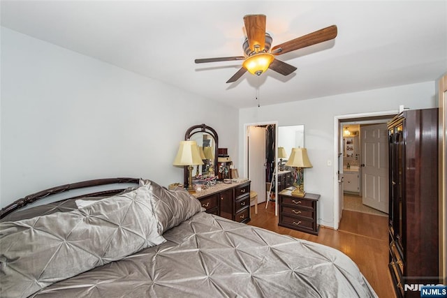 bedroom with wood finished floors and a ceiling fan